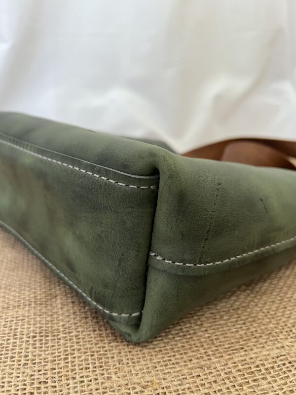 Bottom of small green leather tote