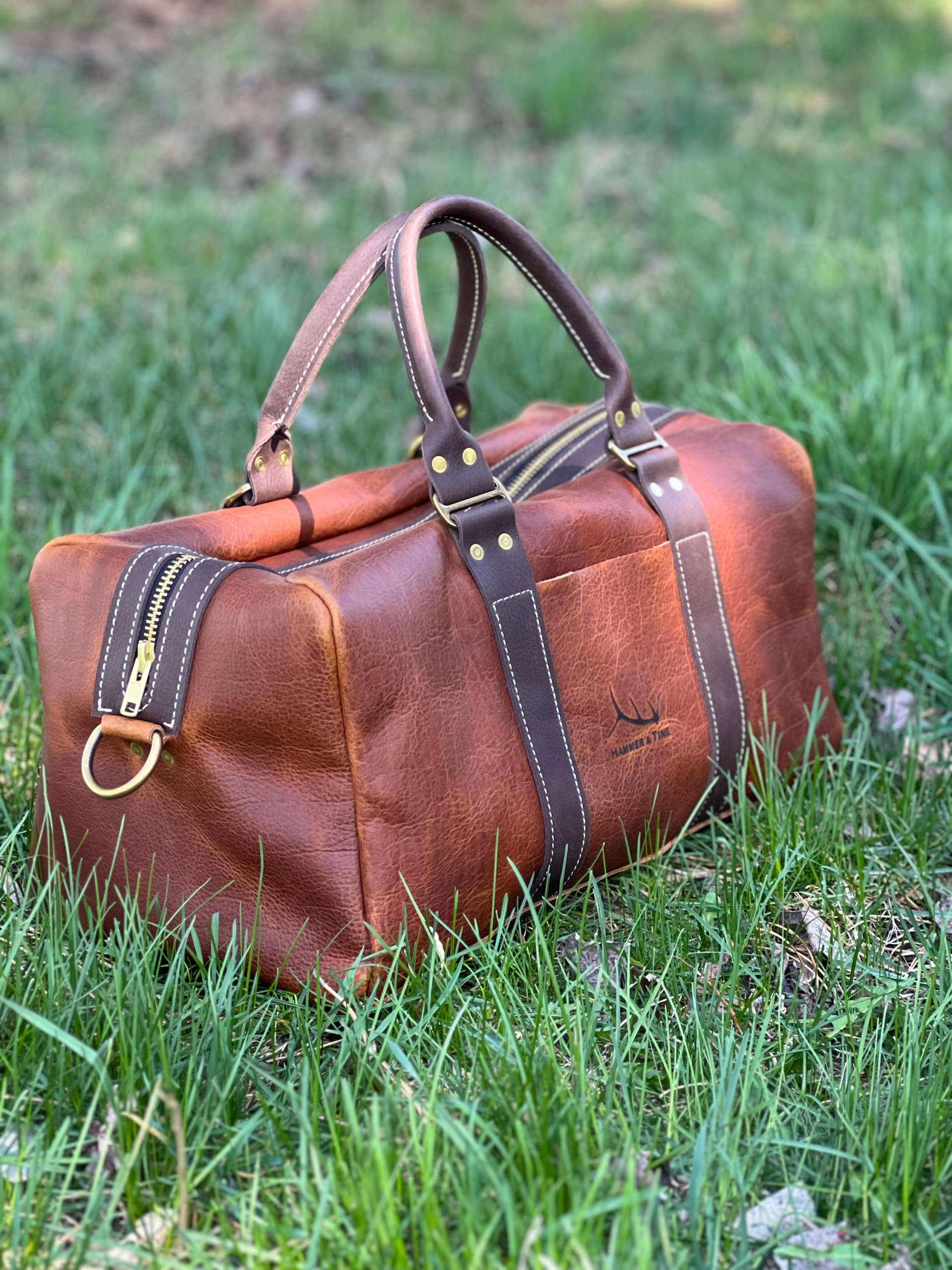 Brown leather duffel bag